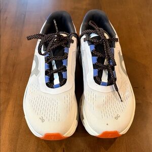 On - Cloud Monster - Running Women's White with blue and orange accents.